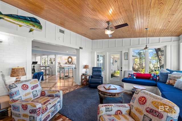 tiled living area featuring wood ceiling, visible vents, and a ceiling fan