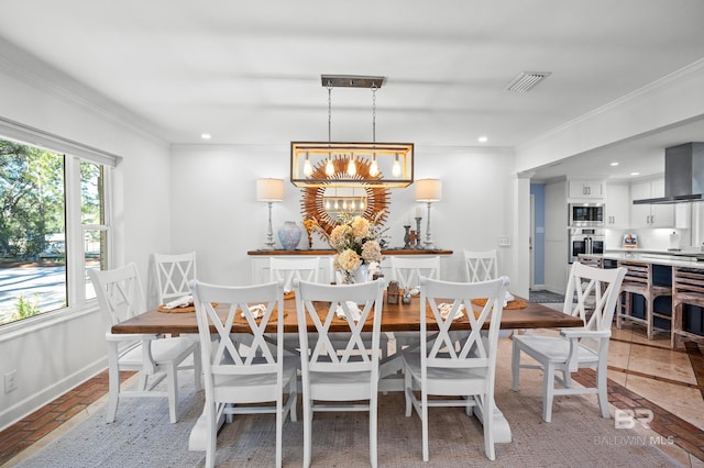 dining room featuring brick floor, recessed lighting, visible vents, baseboards, and ornamental molding