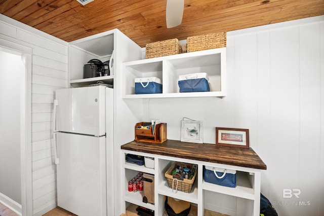 kitchen featuring wood ceiling, butcher block counters, open shelves, and freestanding refrigerator