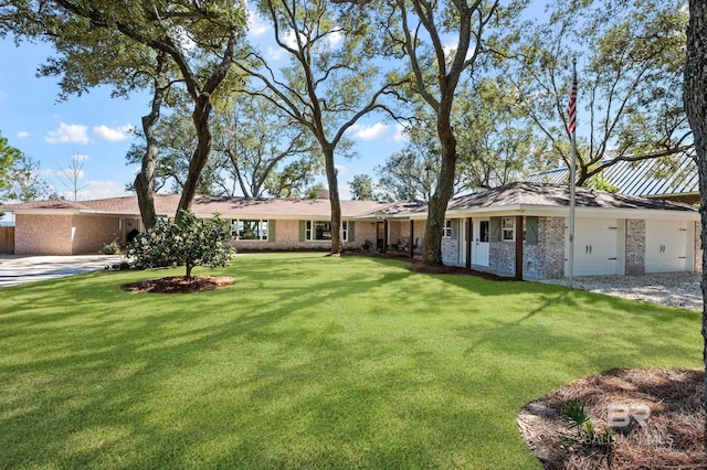 ranch-style home with a garage, a front lawn, and brick siding