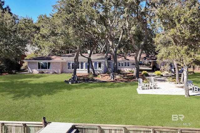 exterior space with a dock and a patio area