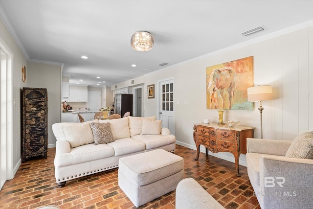 living room with brick floor, recessed lighting, visible vents, and ornamental molding