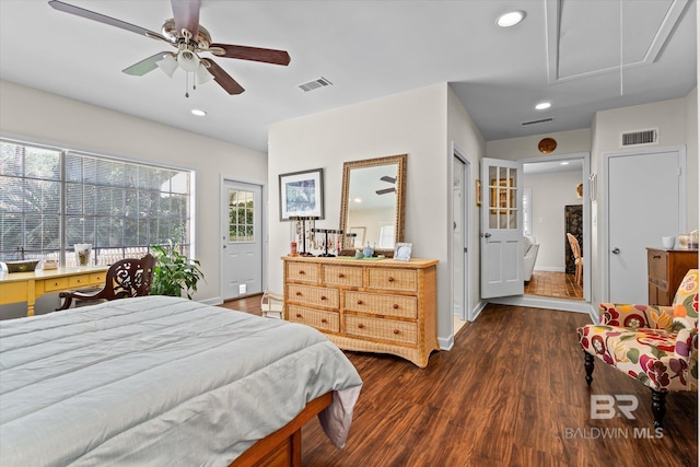 bedroom featuring visible vents, multiple windows, dark wood-style flooring, and attic access