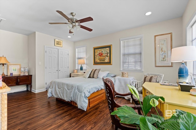 bedroom featuring dark wood-style floors, multiple windows, a closet, and recessed lighting