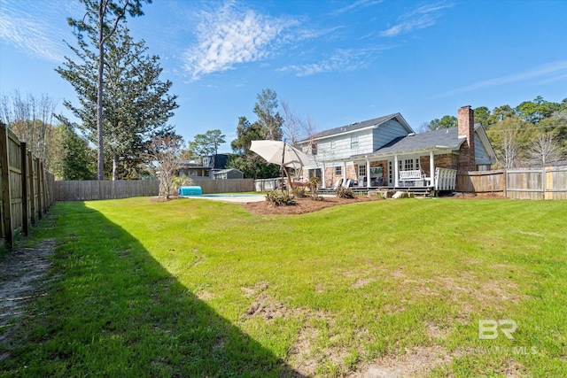 view of yard featuring a fenced backyard, a fenced in pool, and a wooden deck