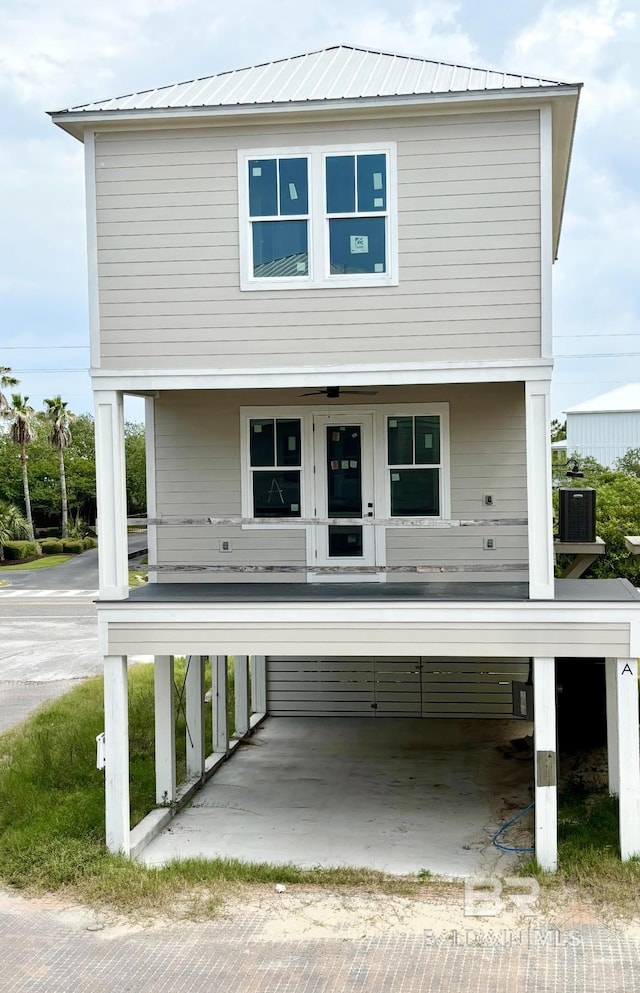 view of front of property featuring metal roof and a porch