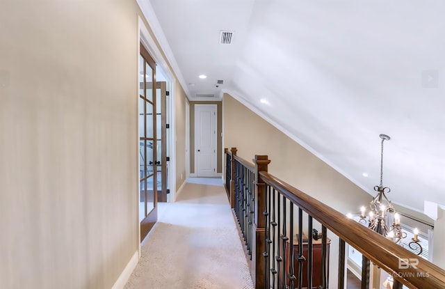 hallway featuring a notable chandelier, recessed lighting, visible vents, an upstairs landing, and baseboards