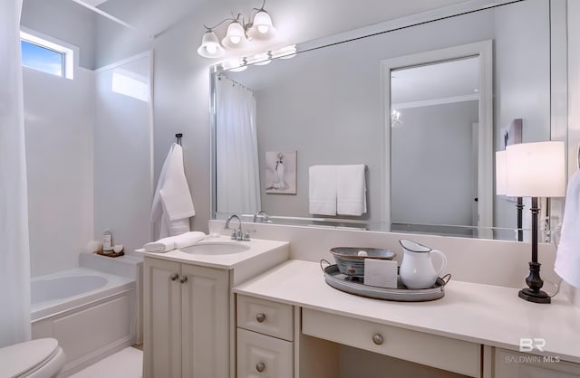 full bath with toilet, a garden tub, vanity, and crown molding