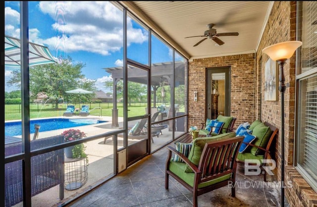 sunroom / solarium with ceiling fan