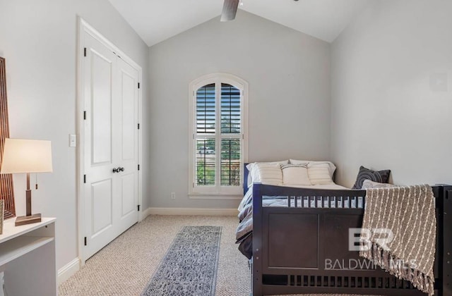 carpeted bedroom featuring lofted ceiling with beams and baseboards