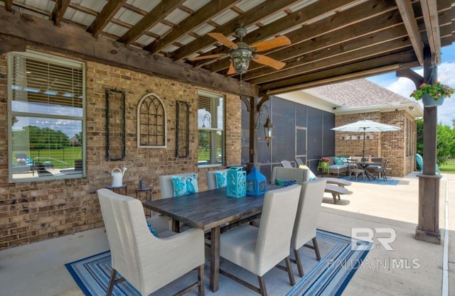 view of patio with a ceiling fan and outdoor dining space