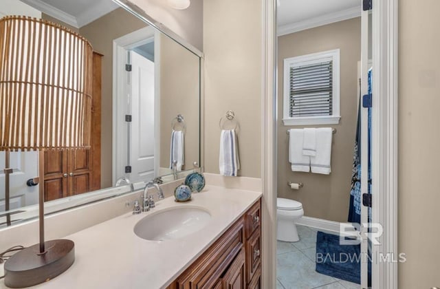 full bathroom with ornamental molding, vanity, toilet, and tile patterned floors