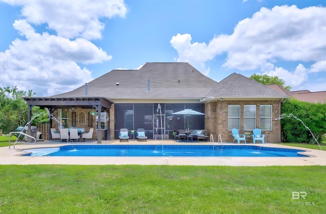 exterior space with a yard, a sunroom, a patio, and grilling area