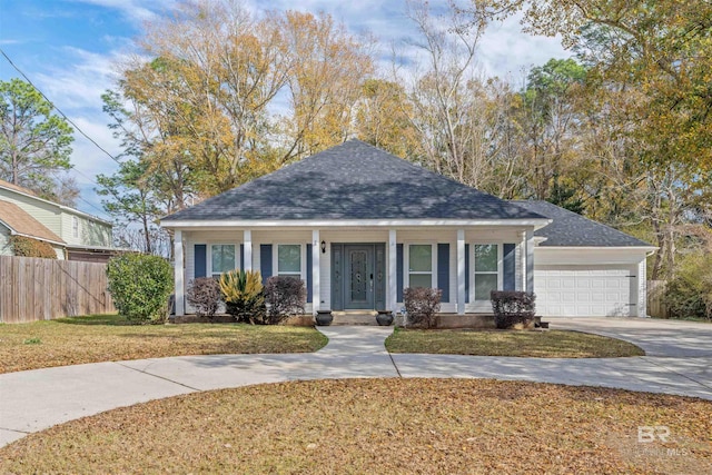 view of front of house with a garage and a front yard