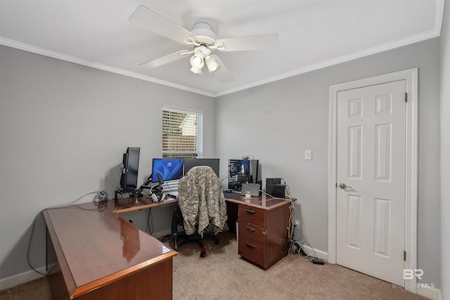 carpeted office space with ornamental molding and ceiling fan