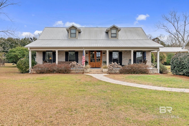 view of front of property featuring a porch, french doors, and a front lawn