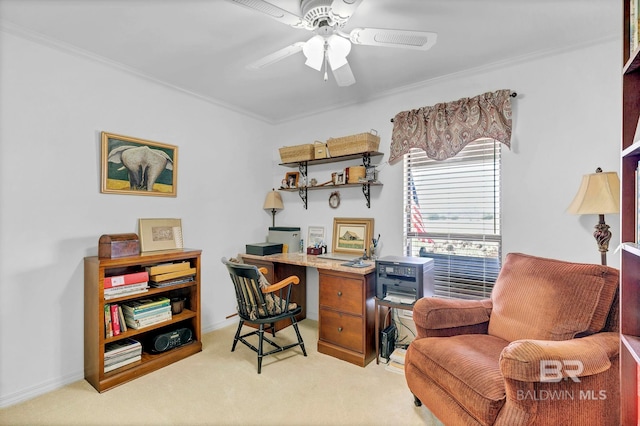 office space with light carpet, ornamental molding, and ceiling fan