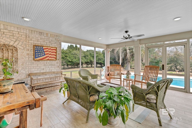 sunroom with ceiling fan and a healthy amount of sunlight