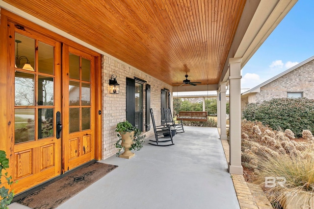 view of patio / terrace with ceiling fan and a porch