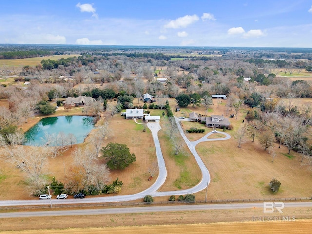 birds eye view of property with a water view and a rural view