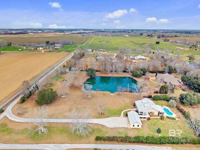 bird's eye view with a water view and a rural view