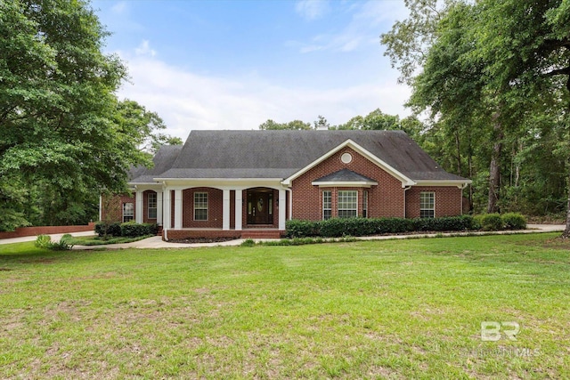 10360 Southern Oaks Dr, Saraland, AL 36571 - view of front facade with brick siding, a porch, and a front lawn