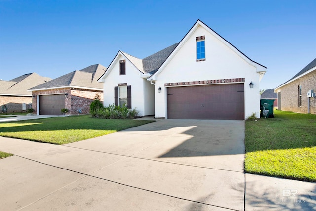 view of front of home with a front lawn and a garage