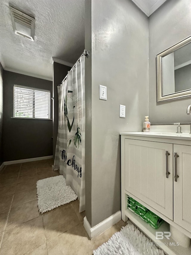 full bathroom featuring baseboards, crown molding, tile patterned floors, and a shower with curtain