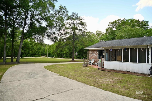 exterior space featuring a sunroom