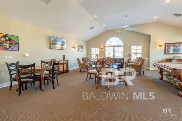 carpeted dining area with lofted ceiling, a ceiling fan, visible vents, and baseboards