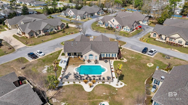 birds eye view of property with a residential view