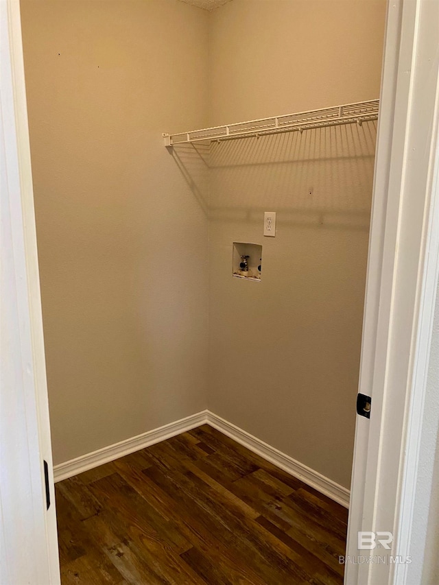 laundry area featuring dark wood-type flooring and hookup for a washing machine