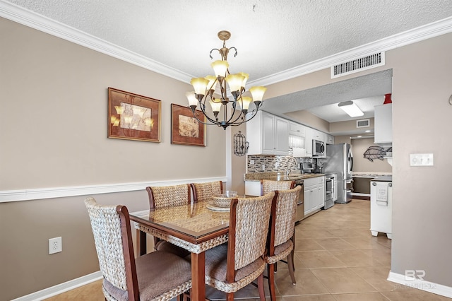 dining room with light tile patterned flooring, visible vents, an inviting chandelier, and ornamental molding