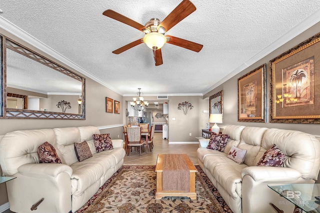 tiled living room with a textured ceiling, ceiling fan with notable chandelier, visible vents, baseboards, and crown molding