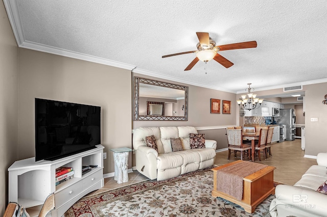 living room featuring light tile patterned floors, ornamental molding, a textured ceiling, and ceiling fan with notable chandelier