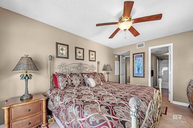 bedroom featuring a textured ceiling, ceiling fan, light tile patterned flooring, and visible vents