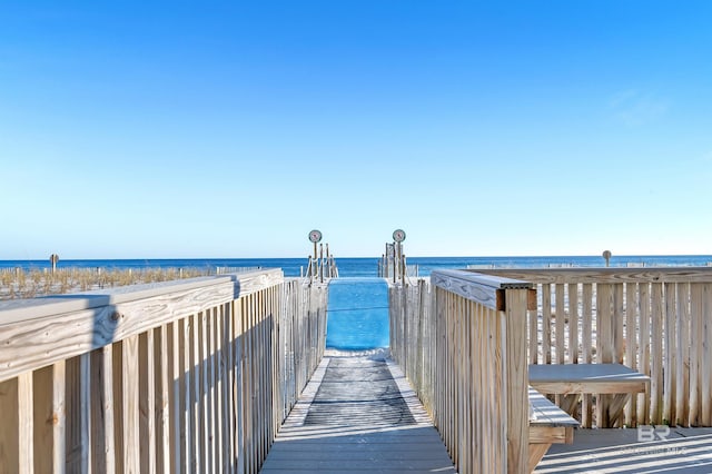 view of property's community featuring a water view and a view of the beach