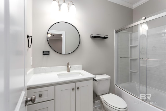 full bathroom featuring shower / bath combination with glass door, ornamental molding, vanity, and toilet