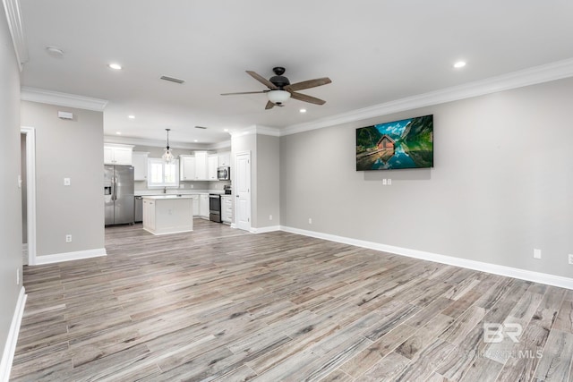 unfurnished living room with ornamental molding, ceiling fan, and light hardwood / wood-style flooring