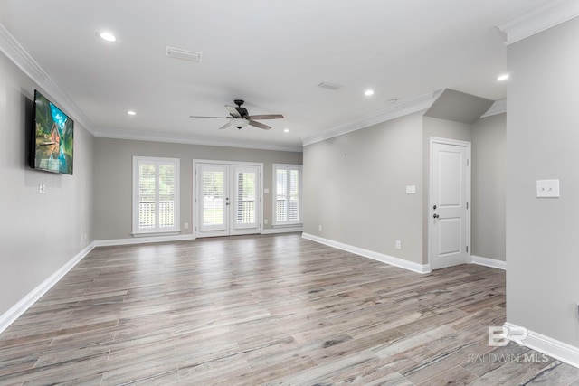 interior space featuring ceiling fan, light hardwood / wood-style flooring, and ornamental molding