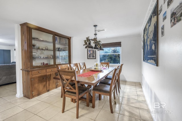 dining area featuring light tile patterned flooring