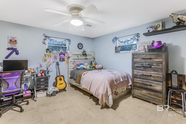 bedroom featuring light tile patterned floors and ceiling fan