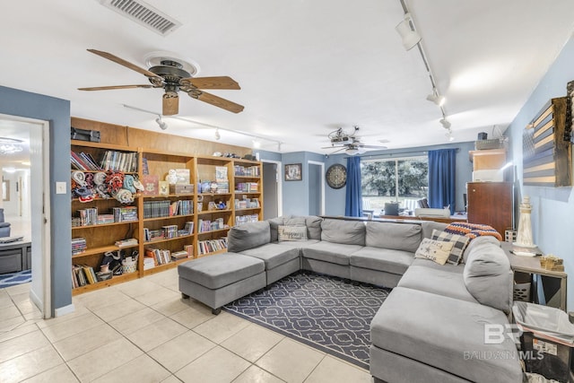 tiled living room featuring track lighting and ceiling fan