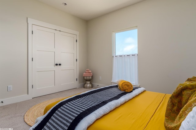 bedroom with light colored carpet