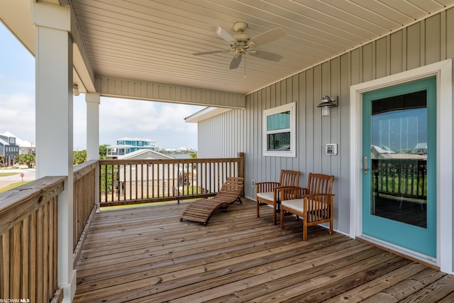 wooden terrace featuring ceiling fan