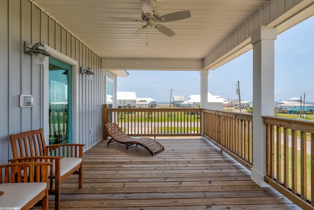 wooden deck featuring ceiling fan