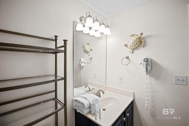 bathroom featuring vanity and a textured ceiling