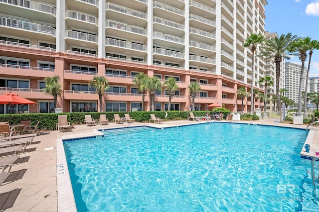 community pool featuring a patio