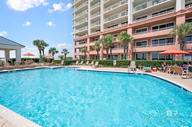 community pool with a patio area