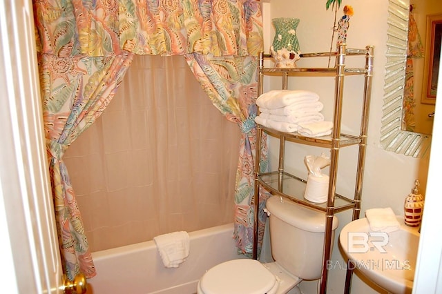 bathroom with shower / bath combination with curtain and toilet